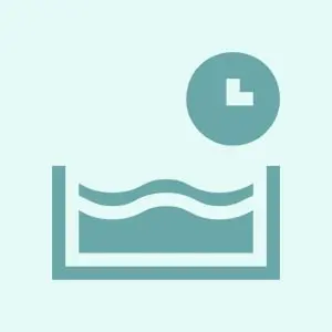Icon showing a clock above a water basin with waves.